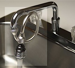 Kitchen Vortex Water Revitaliser installed on sink tap